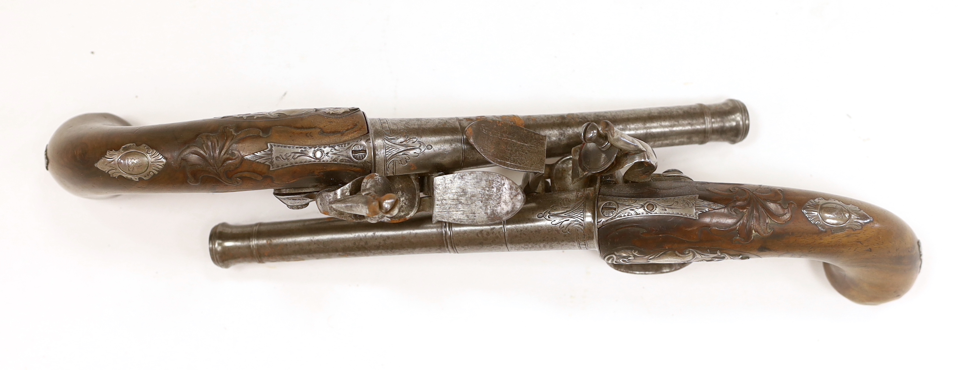 A pair of Queen Anne cannon barrel side hammer flintlock holster pistols by T. Richards, c.1770